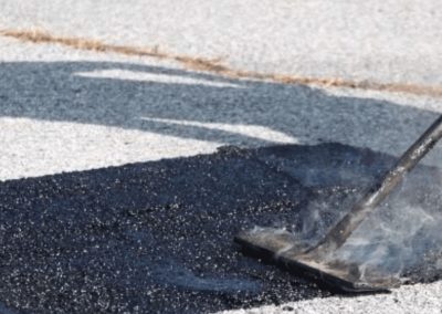 parking lot pothole being repaired