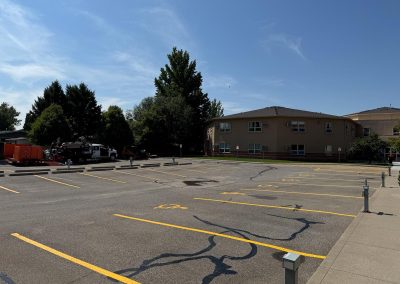 Commercial parking lot after asphalt crack sealing and surface maintenance