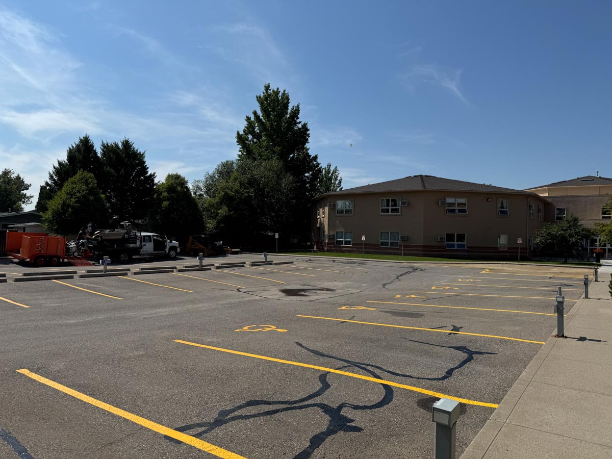 Commercial parking lot after asphalt crack sealing and surface maintenance
